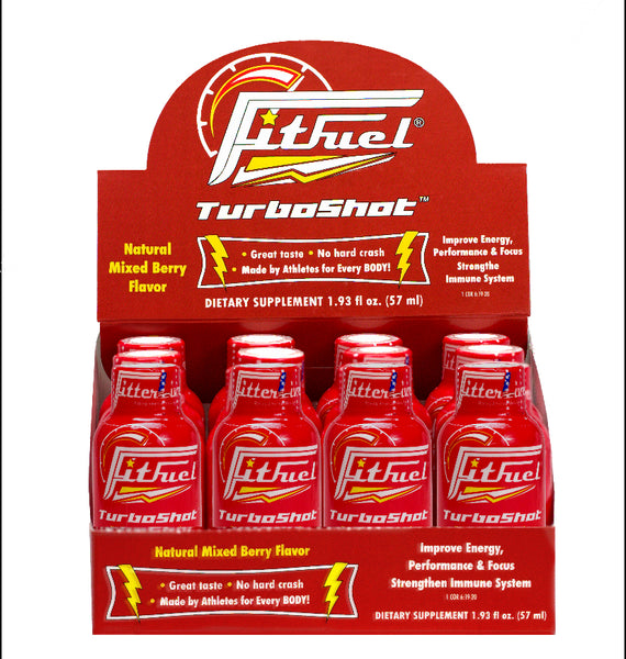 A display of FitFuel TurboShot energy drink bottles in a natural mixed berry flavor, with the product branding and information visible.