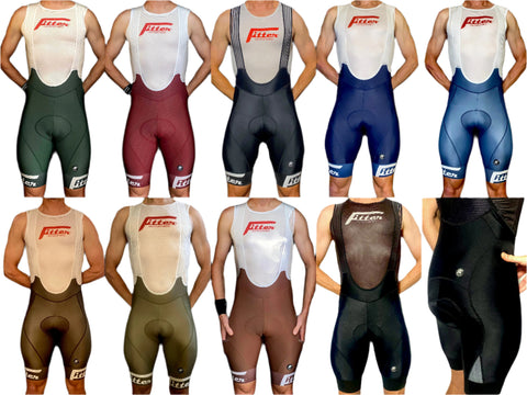 A collection of FiTTER Solio Bibs in various solid colors, featuring a high-performance breathable fabric with Italian chamois, steel-cut compression leg bands, a mini-pocket on the back, and reflective functionality.