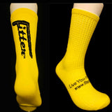 Yellow socks with black text on a black background