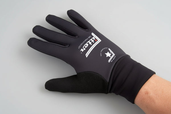 Black glove with a brand logo on a dark background