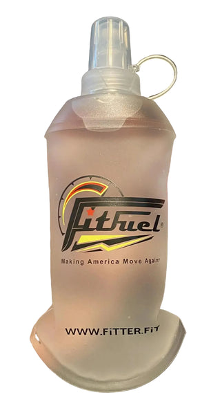 Clear bottle with Fitch Fuel logo held in a hand against a dark background