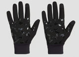 Black glove with textured palm on a dark background