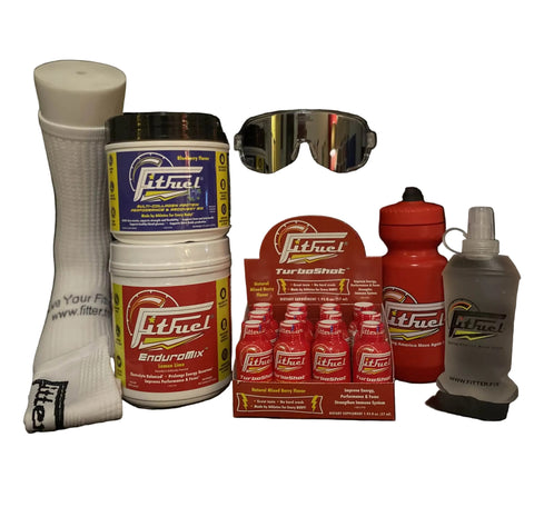 Collection of Fitfuel products including a sock, containers, a bottle, and a box on a black background.