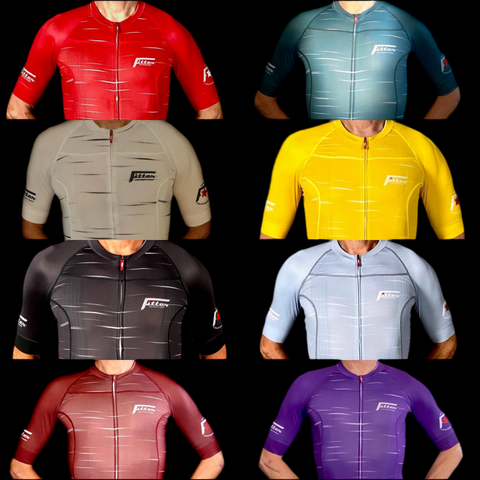 Collection of cycling jerseys in various colors on a black background