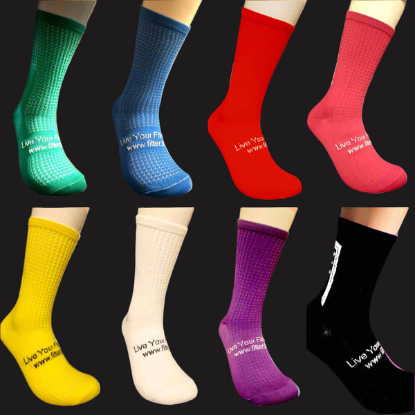 Collection of colorful socks with visible branding on a black background