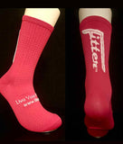 Pink socks with white text on a black background