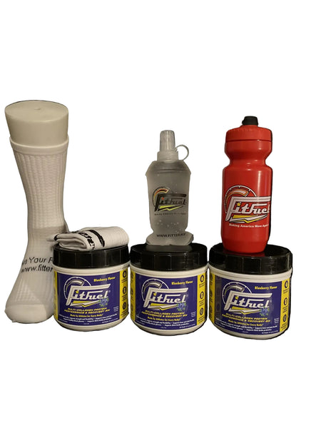 Collection of FitFuel products including a bottle, container, and other items on a black background